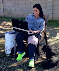 Diana at work in her back yard with her dogs, 2016.
